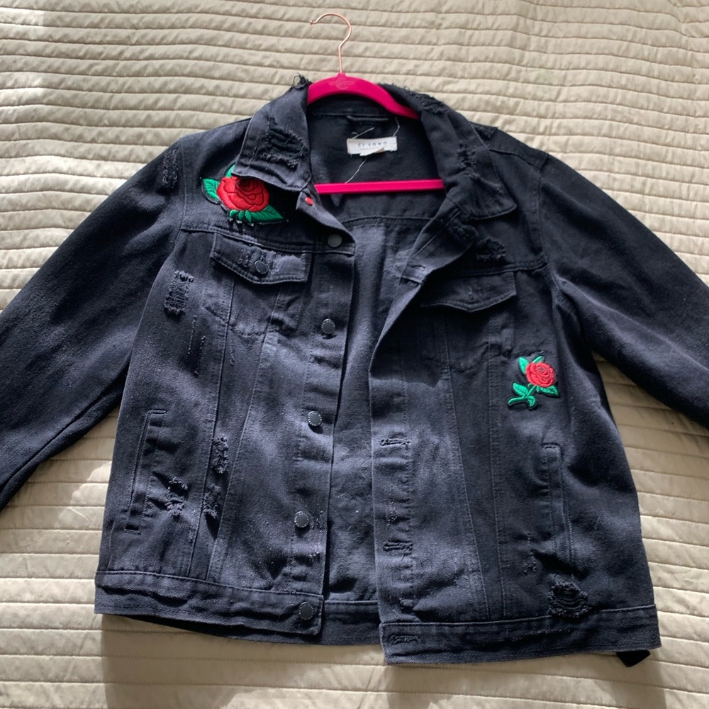 Distressed denim jacket with roses
